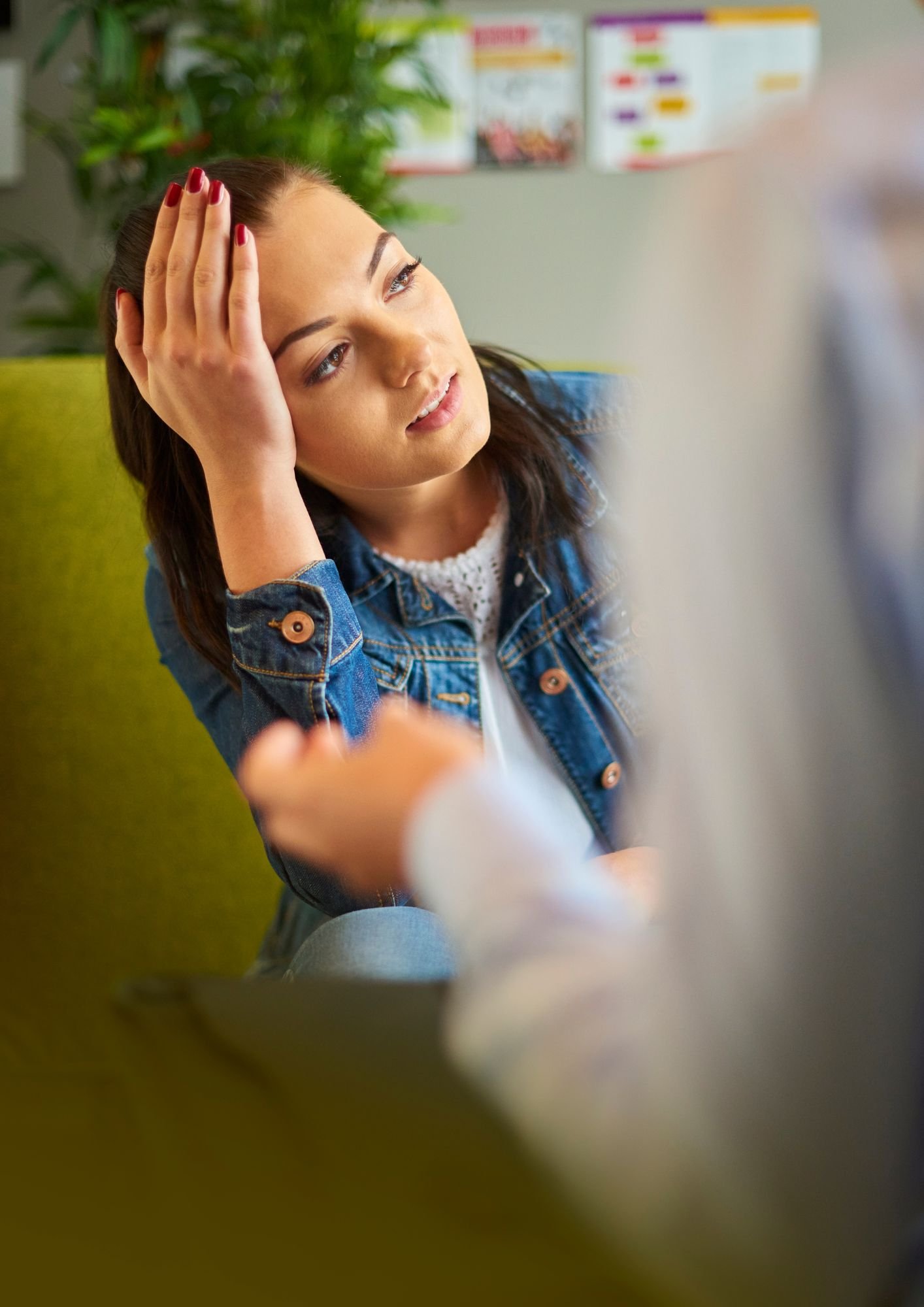 A woman looking down in grief