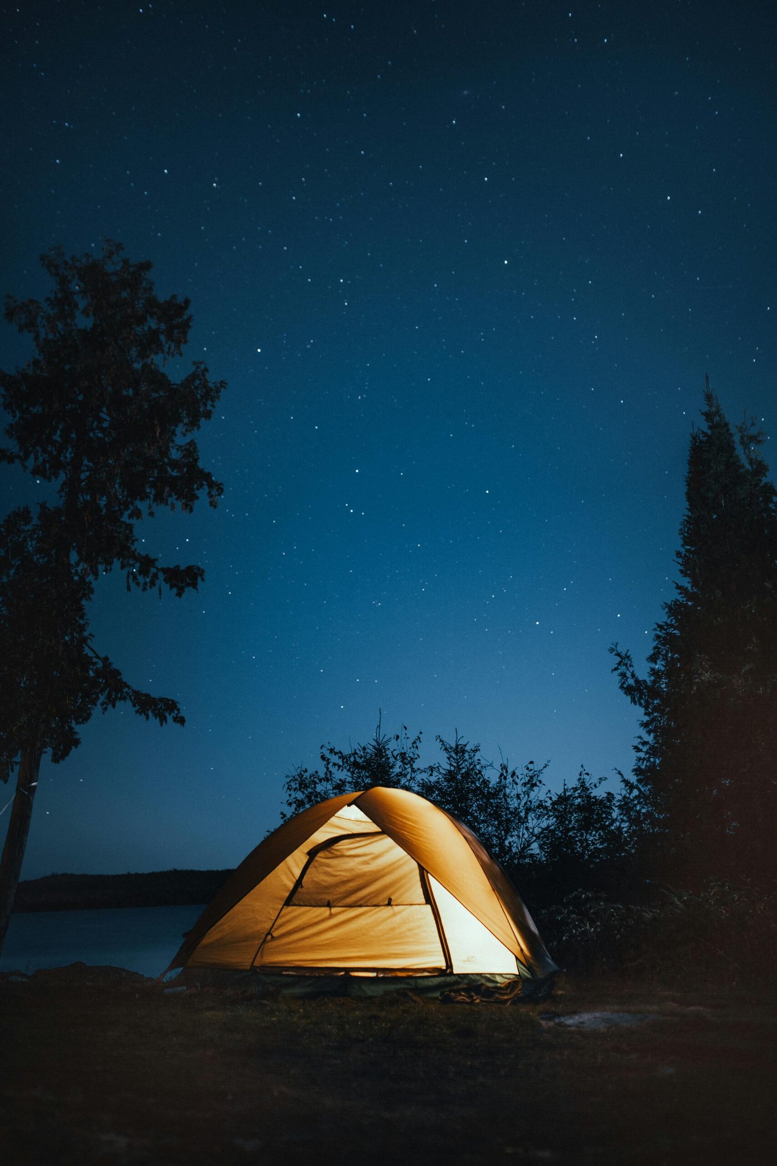 A tent light up at night providing a break from stress and overwhelm