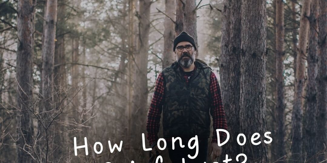 Man walking with a dog in the woods with the text "how long does grief last"