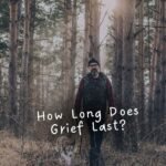 Man walking with a dog in the woods with the text "how long does grief last"