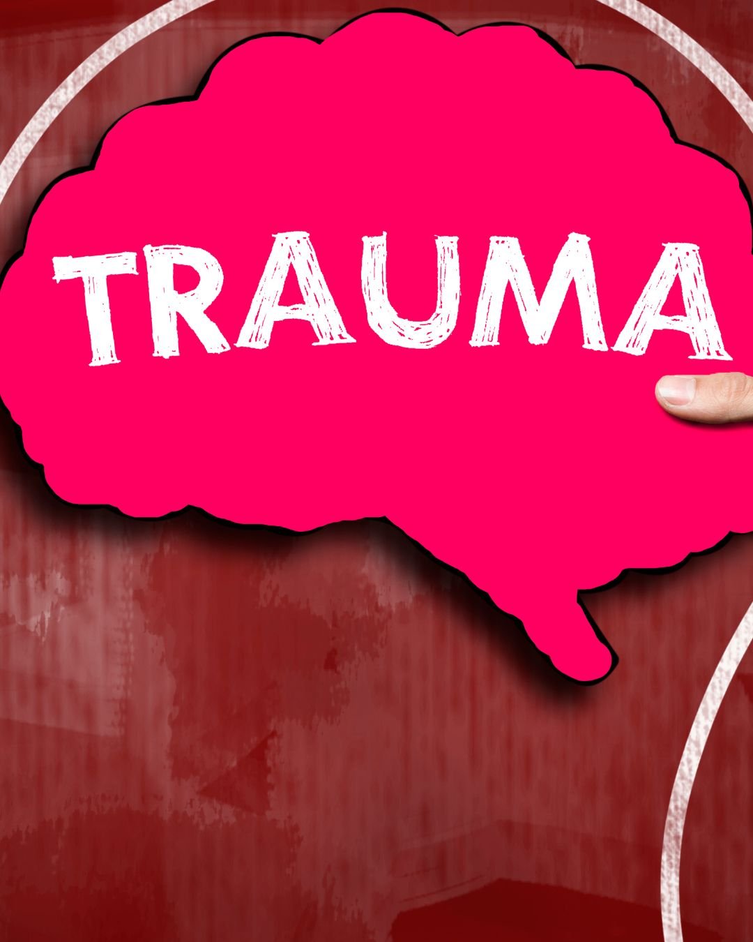 A cutout of a brain with the word Trauma written in to it,