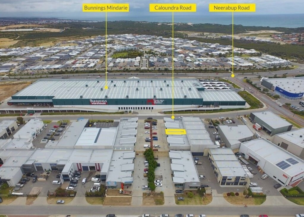 Aerial photo of Clarkson showing bunnings warehouse, neerabup road and The Beach Haven Counselling on Caloundra Road in Clarkson